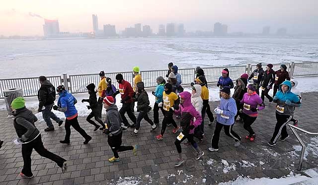 2014 Autoshow Shuffle 5K 010.jpg - 2014 Autoshow Shuffle 5K in Detroit Michigan. A cold day along the river, but accompanied by a great sunrise! Out and back on the River Greenway.